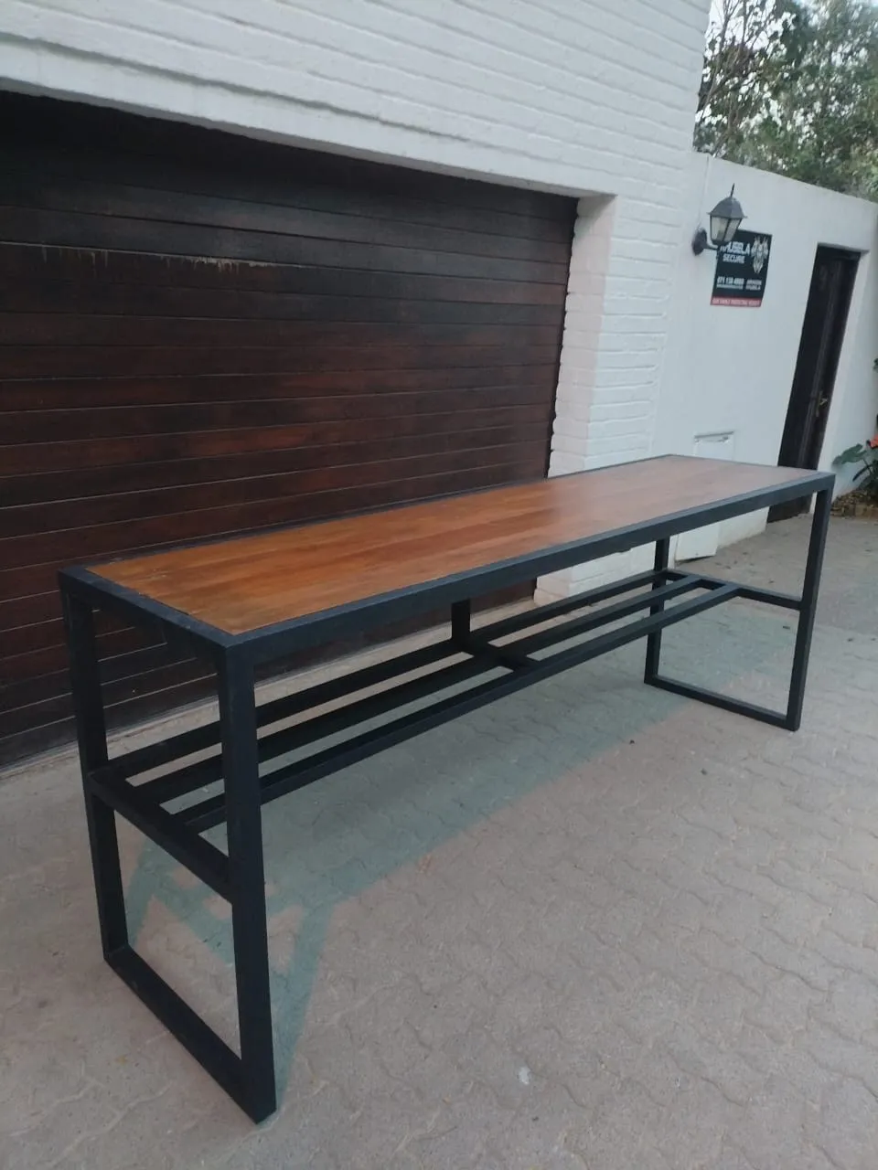 Console table built by Gifted Hands: matt black welded steel frame with a stained hardwood top